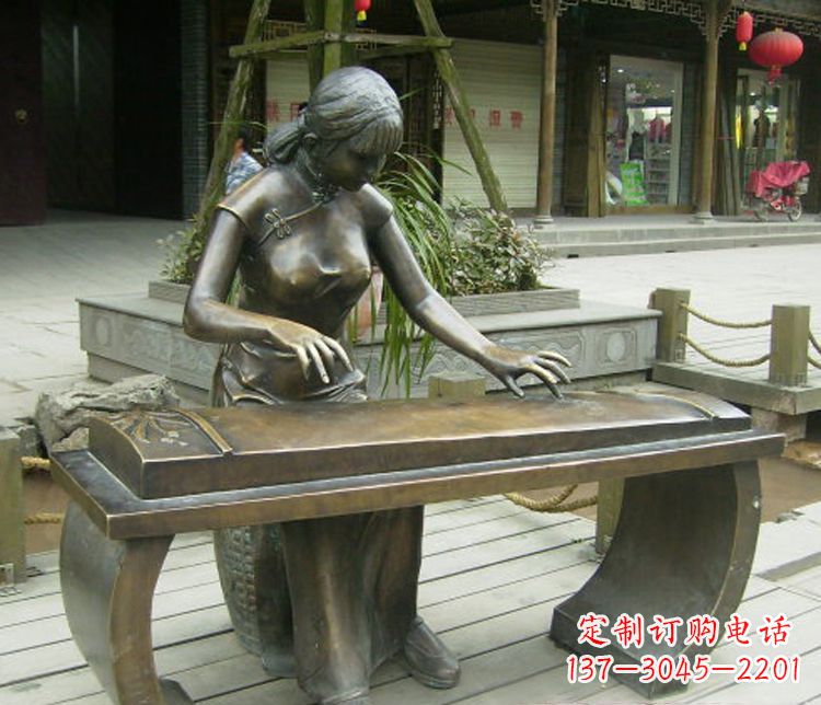 宁夏铜雕现代人物弹古筝雕塑